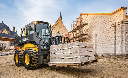 324G hauling landscape stones