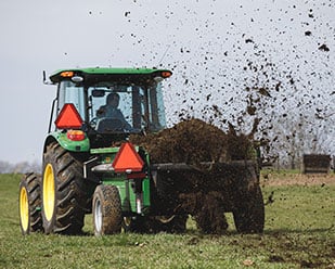 Manure spreader with dual rear SCV