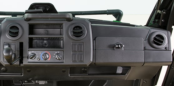 Glove box, storage pocket, and two dash bins (shown on XUV835M cab)