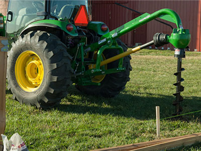 tractor with post hole attachment