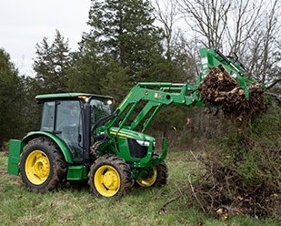 Premium cab with triple mid SCV operating grapple 