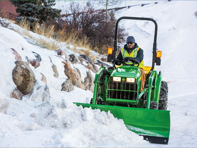 small tractor in snowy hillside