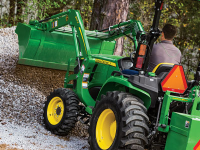 small compact tractor on uneven terrian