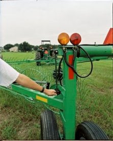 A crank aids the windrow width adjustment