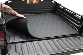 Bedmatâ€”protects the steel floor from dents