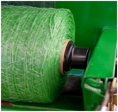 Plugs for Edge-to-Edge surface wrap in a CoverEdge baler