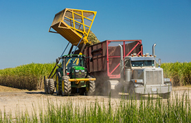 In-field equipment transloading into highway trucks