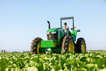 6EH Tractor operating in the field