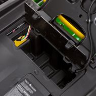 Storage compartment with cover located under seat