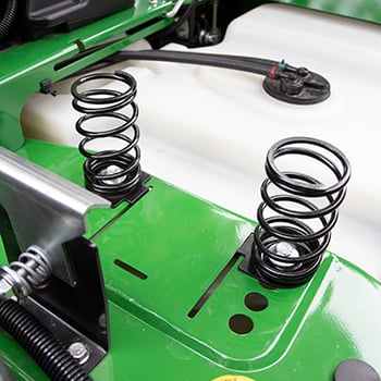 Seat springs in forward position for lighter operators