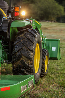 4052M HD with rotary cutter and front loader