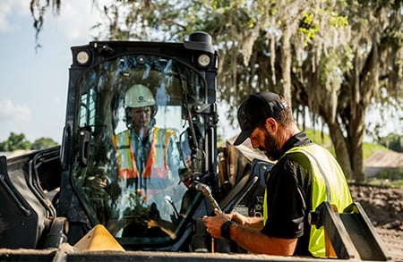 Dealer and Skid Steer Customer