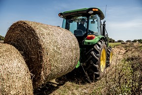 Moving bales with rear bale spear