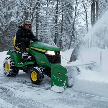 47-in. (119-cm) Snow Blower and tire chains on an X590 Tractor