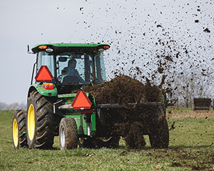 Manure spreader with dual rear SCV