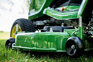 Easy-to-adjust mower wheel and mower side reinforcement