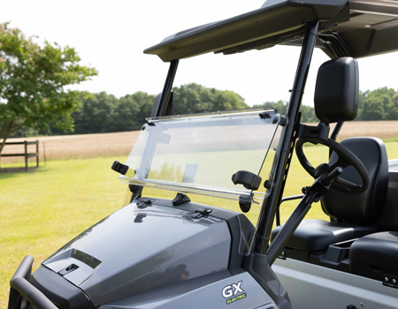 Hinged windshield in lowered position