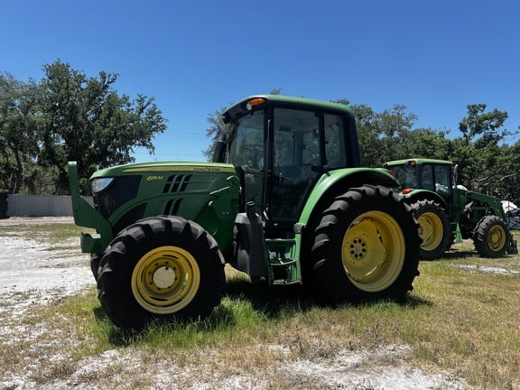 Pre-Owned John Deere 6115M in Plant City, FL Photo 0